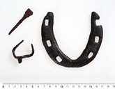 Horseshoe and hoof spike from Ytre Moa. The spike was inserted in the horseshoe and bent to keep it fastened.