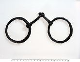 Bridle cheek rings from Ytre Moa. A bridle is the headgear used to control a horse. It consists of leather straps, a metal bit and reins.