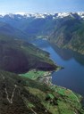 An aerial view of Aurland and the Aurlandsfjord. We can see the village of Flåm at the head of the fjord.