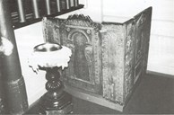 In connection with the centenary festivities in 1938, a special sexton's chair was built from components of decorated church chairs from the latter half of the 17th century. The font is made by the school 'Holmøyane Arbeidsskule'. The baptismal bowl dates from the 1780s, but the holy water ewer is undated.