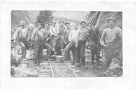 A work team with horse and a so-called stump puller, seen to the right behind the work team.  Each rock was lifted up on the wall with a stump puller, and four men pulled the rock in place by means of levers. The Bergen Railway, and later on the Flåm Railway, created a working class in the municipality of Aurland. In 1900, 30 out of the 524 men who worked at the construction sites came from Aurland. In the summer months, this number increased as the railway then employed seasonal workers. Many of these came from Flåm. 