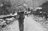 Here we see Matias Guldbakke about 1920, standing on the road that went out from Svelgen along the south side of the Nordgulen fjord. 
