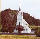 The church has a nice location on the old Holmedal farm on the northern shores of the Dalsfjorden. This was also the site of the former log church in Holmedal from about 1600.  