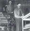From the activity in the printing works which was in the founder Kristian Ulltang's house at Teigen. The two persons working in the printing works were Gunnar S. Hafstad (closest) and Karl I. Mo.