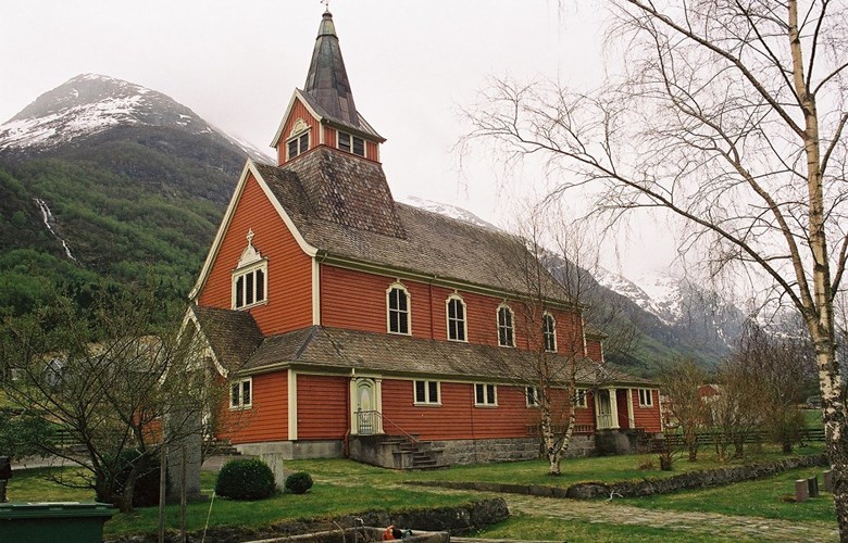 Olden church is situated on the farm of Brynestad some distance south of the village centre of Olden. The house in the foreground is the so-called 'English house', used as a residence for English lords while they were fishing for trout and salmon in the Olden river.