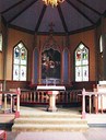 The church has an open chancel painted in warm colours. The stained-glass paintings add to the beauty of the church. The altarpiece from 1914 has the Holy Communion as its motif. The text 'In remembrance of me' is taken from Christ's institution of the Holy Communion.
