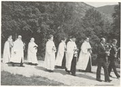 The procession on its way from the school to Berle chapel on the day of consecration. From right to left: Reidar Ytre-Hauge, Gudmund Olsbø, the vicars Matias Austrheim, Odd Keilen, Audun Aase, Jon Heføl, former dean Sverre Myklebust, dean J. M. Langeland, and bishop Thor With.