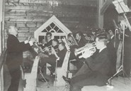 Alf Rosenlund conducts the band at the back of the church.