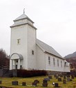 Rugsund church is today located on the mainland, whereas the old church site was on the island of Rugsundøya. From the main entrance there is an excellent view of the bay towards the landmark of Hornelen.