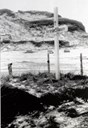 'Here lie 21 Russians'. The wooden cross on the war grave on the churchyard at Ervik. The bodies were moved to Laksevåg, Bergen in the autumn of 1953.