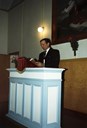 Olav Molde (1919-2005) on the rostrum at Dalsøyra "bedehus". He was active in various organizations, and he sat for five periods in the municipal council. In the Christian work the Sunday school and "Indremisjonen" (evangelism) were his main fields of interest. For many years he was chairman of the "Ytre Sogn Indremisjon". From 1976 he sat on the board of "Sogn Indremisjonskrins".  In 1999, Olav Molde and his wife Eldbjørg were awarded the King's Medal in silver for distinguished civil service. Olav Molde died in 2005. He wrote the publication <i>Om Dalsøyra bedehus - og verksemd</i> (2001), and this article is an extract from his publication.
