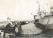 The Br. V. Færøy rented the M/S "Presthus" from Bergen as a winter herring purse seine vessel for a four-year period from 1954. The dories are marked Br. V. F.. They owned the light motor boat and the purse seine themselves. The crew are from Solund, Bjarne Færøy being the skipper. This popular and enterprising man had been the skipper also of the "Flatøy", the "Sørfold", the "Sebaldi", and the "Polhavet".