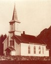 The exterior of the church between 1861 and 1931. It was painted white, and had narrow, high windows with pointed arches on the side walls. The ridge turret also had a different form.

Dating: 1872.
Owner: In <i>Årbok for Sogn 1995.</i>
Photographer: K. Knudsen.