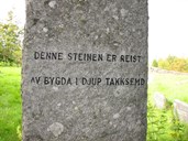 The inscription at the back of the memorial stone.