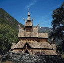 The most distinctive feature of the Borgund stave church is its exterior, and it is worth noticing the round turret above the eastermost part of the chancel. The cylindrical turret and the conical steeple are unique, and at the very top of the roof is the ridge turret which gives the church an especially elegant and majestic look.