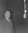 Paul Berstad was mostly known as a singer. He sang simple folk tunes, but also more difficult classical songs. The pictures shows him recording either for a radio programme or at a record studio.