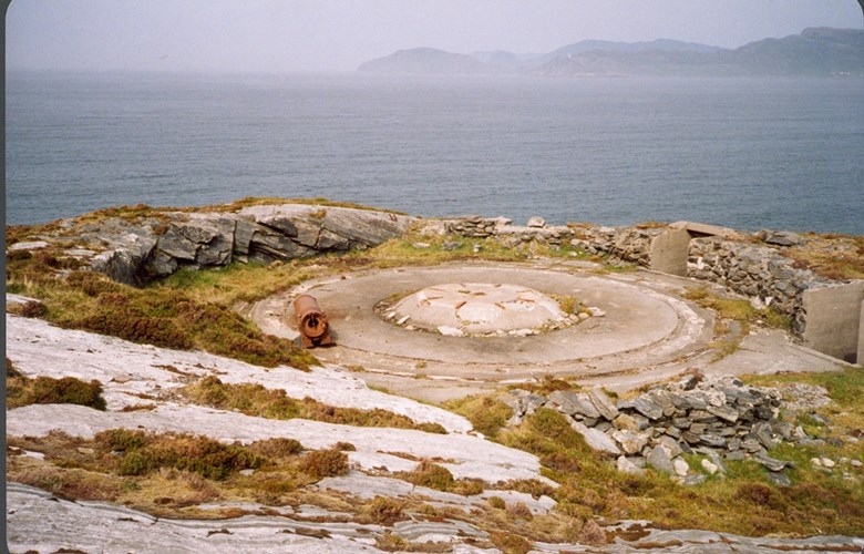 The picture shows the foundation of the third gun in the German coastal fort at Storeneset. The gun was a French 155mm field gun, and it was therefore necessary to have a big platform to turn the gun around. In the background a view towards Vanylvsgapet and the island of Kvamsøy.