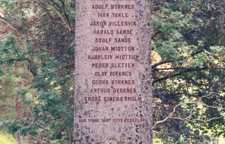The memorial stone for war victims at Eivindvik stands close to the gate in to the church. 16 names are carved into the stone, all who died from the then municipality of Gulen in the Second World War.