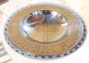 The baptismal bowl from 1909 carries this inscription: 'Mjomen (Mjømna) church. In the Name of the Father, the Son, and the Holy Spirit'.
