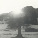 This picture was taken at winter solstice on 22 December 1962 at 11.25am by the vicar at Gulen, requested by the historian Anders Skaasheim from Balestrand. The cross was then in the lower part of the area lit by sunshine, and was only lit for a short while. According to Skaasheim, the Gulating site was located at Eivindvik, and he thought it was a good sign that the sun shone all the year at the court site.
