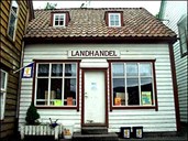 The Rugsund store is 'squeezed in' between one of the warehouses and the residence. Here customers can buy groceries, fishing tackle, lubricants, souvenirs, and misc. articles. Just like in the good old days, trading takes place across the counter. 
