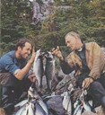 Dr. Odd Martens accompanied  Helge Ingstad to "Vinland". In the photo Martens can be seen to the right, together with Erling Brunborg. They have been angling for trout in Hawke's Bay in Labrador. Who caught the largest trout? 