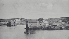 Kjempenes was a trading centre from 1740 until the mid-19th century. This is a view of the place in 1909, long after the trading activities had ended. The chapel , in the background to the left , was erected in 1906, but the bell and the steeple were not added until 1913.