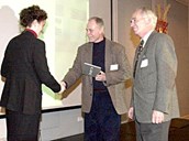 The cabinet minister Sylvia Brustad presents the classic award from Norwegian Design for the model 'Nying' to the designer Tor Bernhard Indregaard and the managing director Svein Helle.